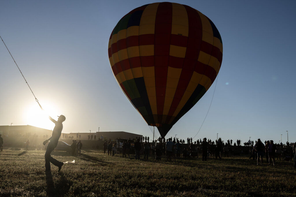 Crews work to get hot air balloons into the air at sunrise during the Erie Balloon Festival on Saturday, July 11, 2026.