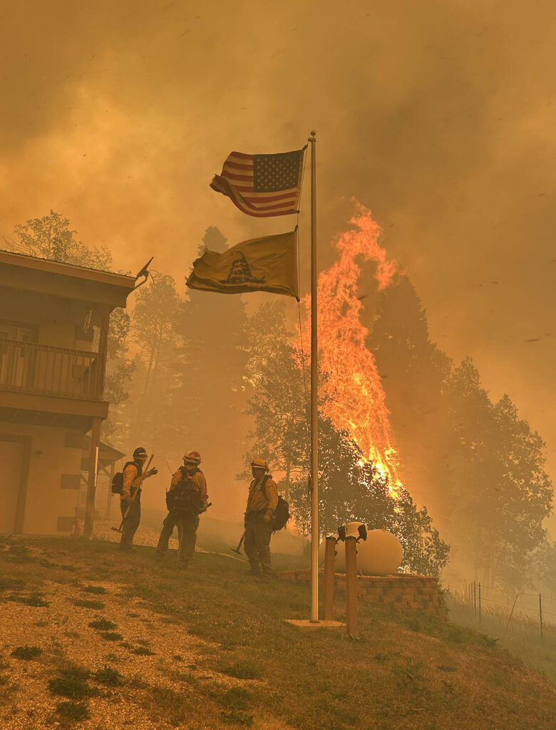 'This I will defend:' Volunteer firefighters with the Southern Colorado Interagency Wildland Fire Team, including Amanda Wood (far left), work on "prep and hold" structure protection during the Aspen Acres fire, June 30 and July 1. Photo courtesy of Amanda Wood.