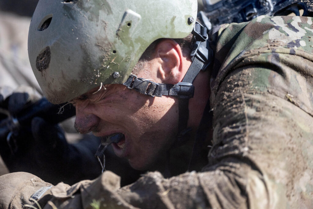 This image has an empty alt attribute; its file name is 071626-CSG-news-ms-USAFA-basic-training_0005-1-1024x683.jpg
A basic cadet grinds through the sand on his stomach after being doused with water during Basic Cadet Training at the U.S. Air Force Academy in Colorado Springs on Thursday, July 16, 2026. (The Gazette, Michael G. Seamans)