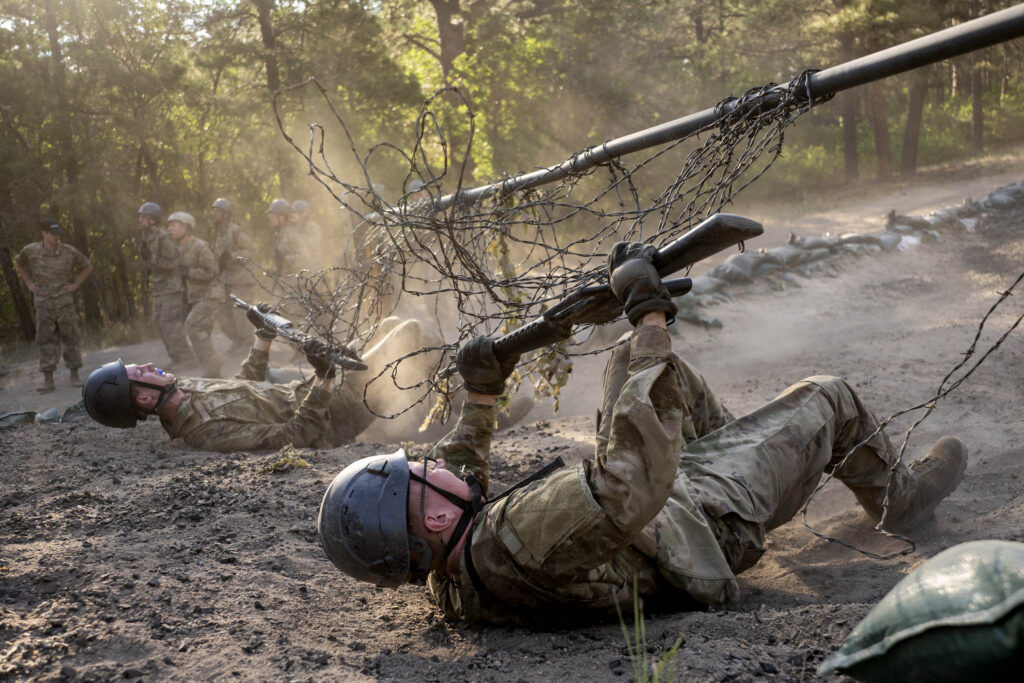 Basic cadets crawl underneath barbed wire during Basic Cadet Training at the U.S. Air Force Academy in Colorado Springs on Thursday, July 16, 2026. (The Gazette, Michael G. Seamans)