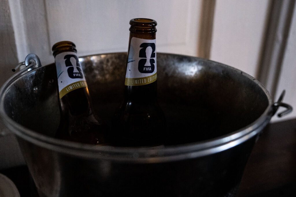 Buckets of beer are passed between fans during a watch party at Maria Empanada on South Broadway for the Argentina vs England World Cup semifinals on Wednesday, July 15, 2026.