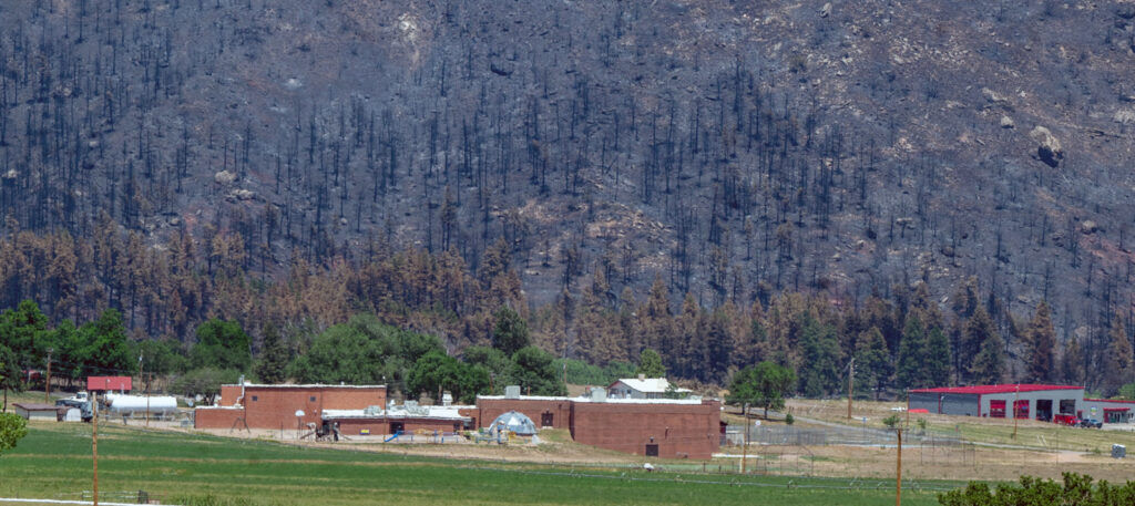 The Beulah School and the Beulah Fire Protection and Ambulance District were some of the many buildings and homes saved by the monument efforts of firefighters from the Aspen Acres Fire. The fire literally surrounded the town. (The Gazette, Jerilee Bennett)