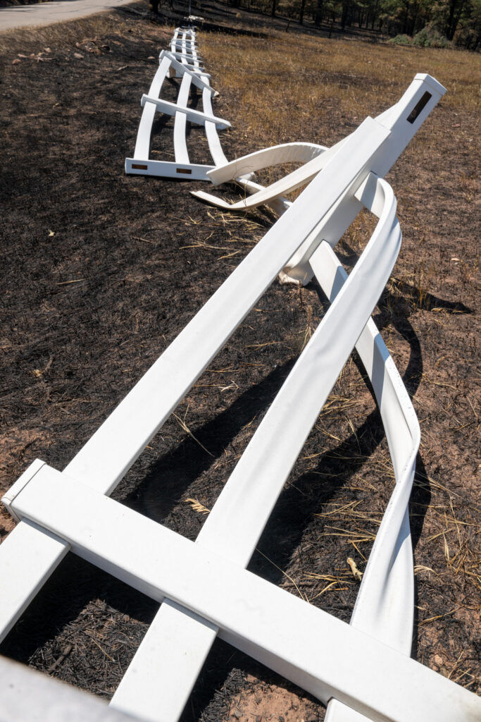 Plastic fencing looks like modern after on Northcreek Rd. in Beulah after the Aspen Acres Fire on Tuesday, July 14, 2026. (The Gazette/ Jerilee Bennett)
