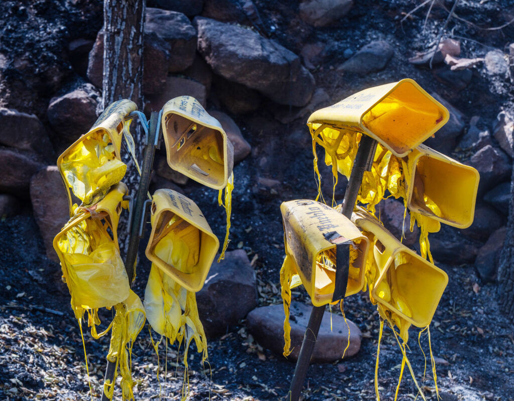 
Pueblo Chieftain newspaper boxes didn’t make it through the fire on Pine Dr. during the Aspen Acres Fire on Tuesday, July 14, 2026. (The Gazette/ Jerilee Bennett)