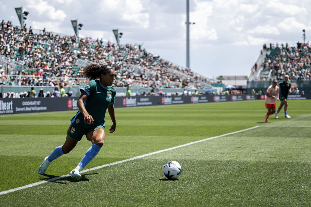 Denver Summit FC forward Yazmeen Ryan (9) kicks for goal from the corner during the second half of Summit FC’s first game at Centennial Stadium on Saturday, July 18, 2026. Summit won against Portland Thorns FC 2-1.