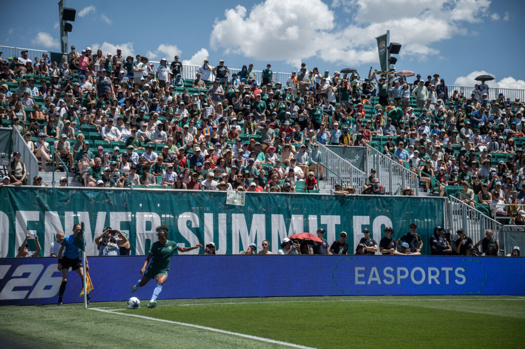 Denver Summit FC forward Yazmeen Ryan (9) makes a corner kick near the Portland Thorns FC goal line during the second half of Summit FC’s first game at Centennial Stadium on Saturday, July 18, 2026. Summit won 2-1.