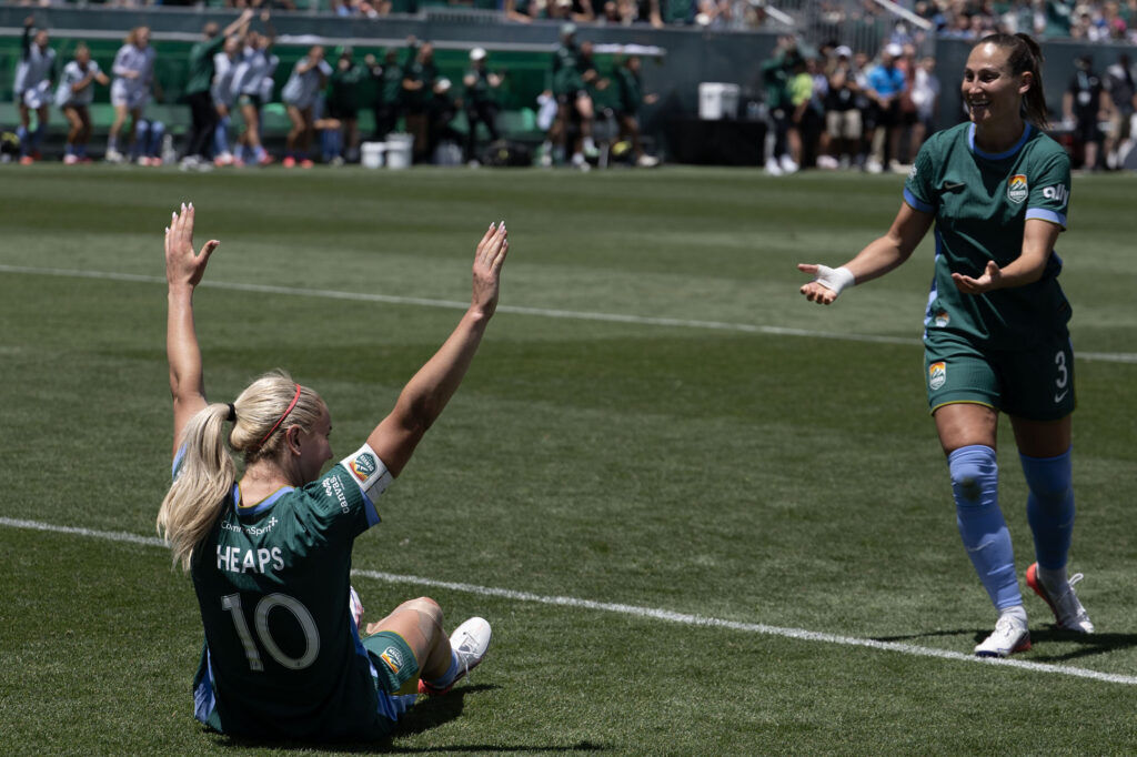 Summit FC Midfielder Lindsey Heaps (10) and Denver Summit FC defender Kaleigh Kurtz (3) celebrate scoring the first goal of Summit FC’s first game at Centennial Stadium on Saturday, July 18, 2026. Summit won against Portland Thorns FC 2-1.