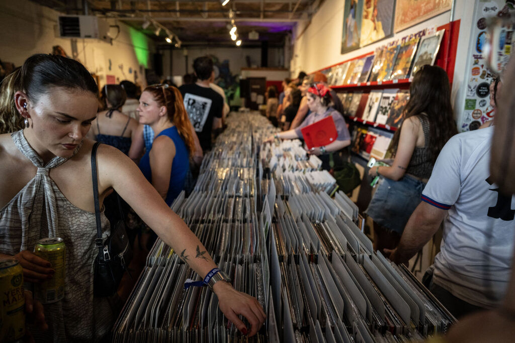 People shop for music during a performance at Wax Trax on South Broadway during Blucifer’s First Rodeo music festival on Saturday, July 25, 2026.