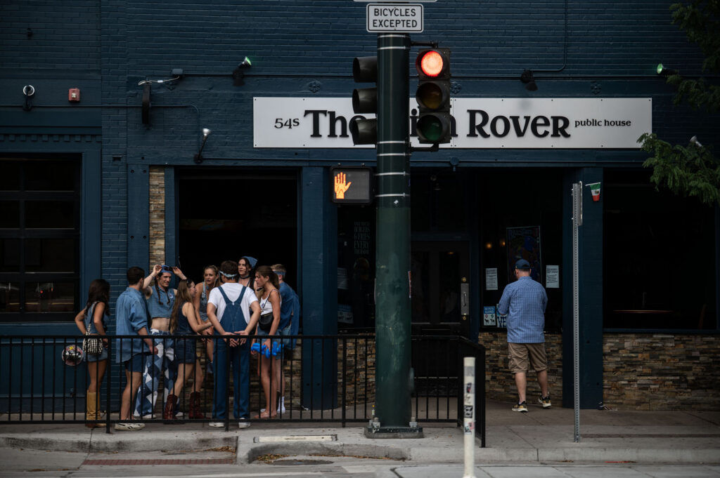 People wait outside the Irish Rover for the start of a show with Blucifer's First Rodeo music festival on South Broadway on Saturday, July 25, 2026.