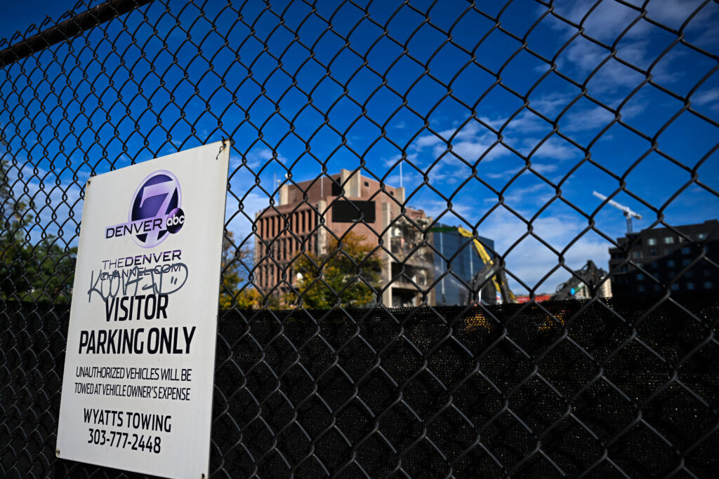 Crews work to tear down the old Channel 7 building on the corner of Lincoln and Speer Boulevard on Wednesday, Oct. 1, 2025.