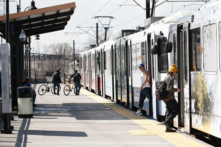 Passengers board and step off an RTD train (copy) (copy) (copy)