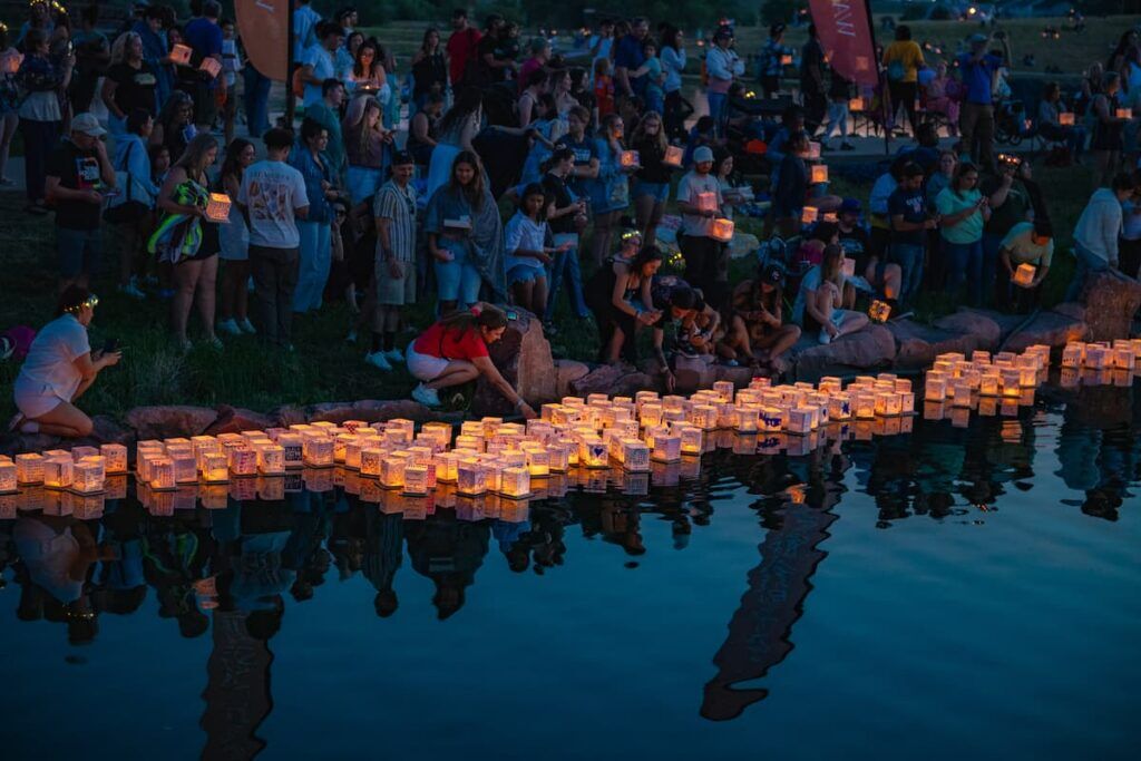 People release their lanterns onto the water at the Water Lantern Festival. (Photo courtesy of the Water Lantern Festival)