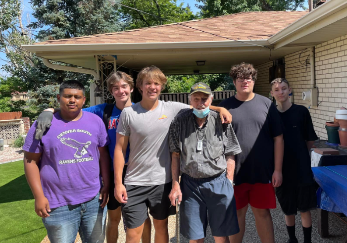 South HS Football Players Pictured with ALH Older Adult Member Frank. (Courtesy, A Little Help).