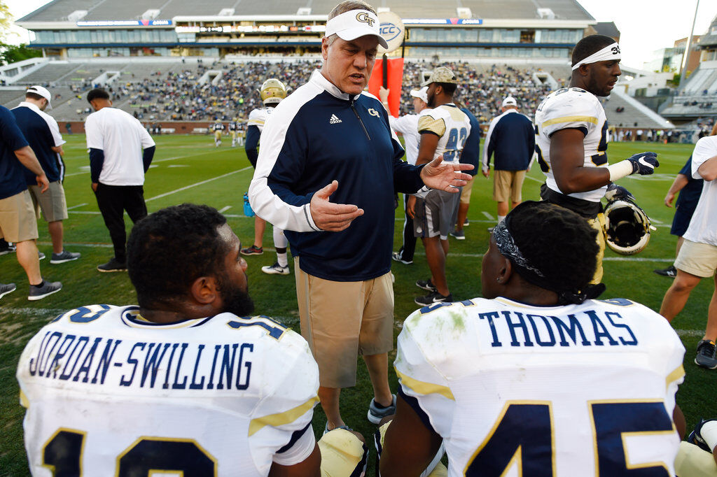 Georgia Tech first-year defensive coordinator Nate Woody speaks to players during a Georgia Tech spring football intra-squad scrimmage, Friday, April 20, 2018, in Atlanta. (AP Photo/Mike Stewart)