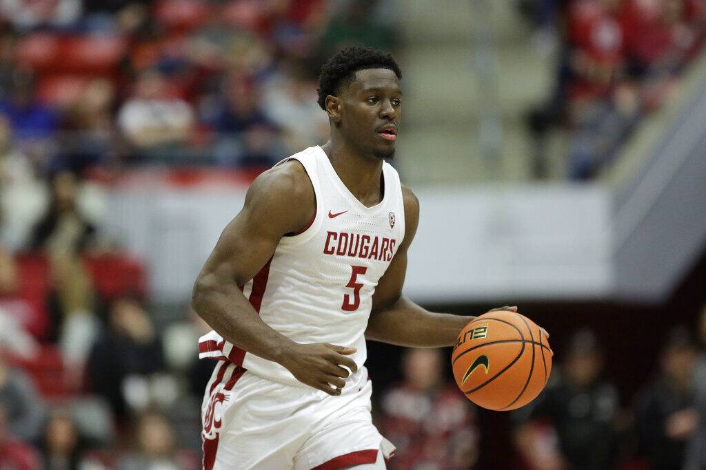 Washington State guard TJ Bamba controls the ball during the second half of an NCAA college basketball game against Arizona State, Saturday, Jan. 28, 2023, in Pullman, Wash.