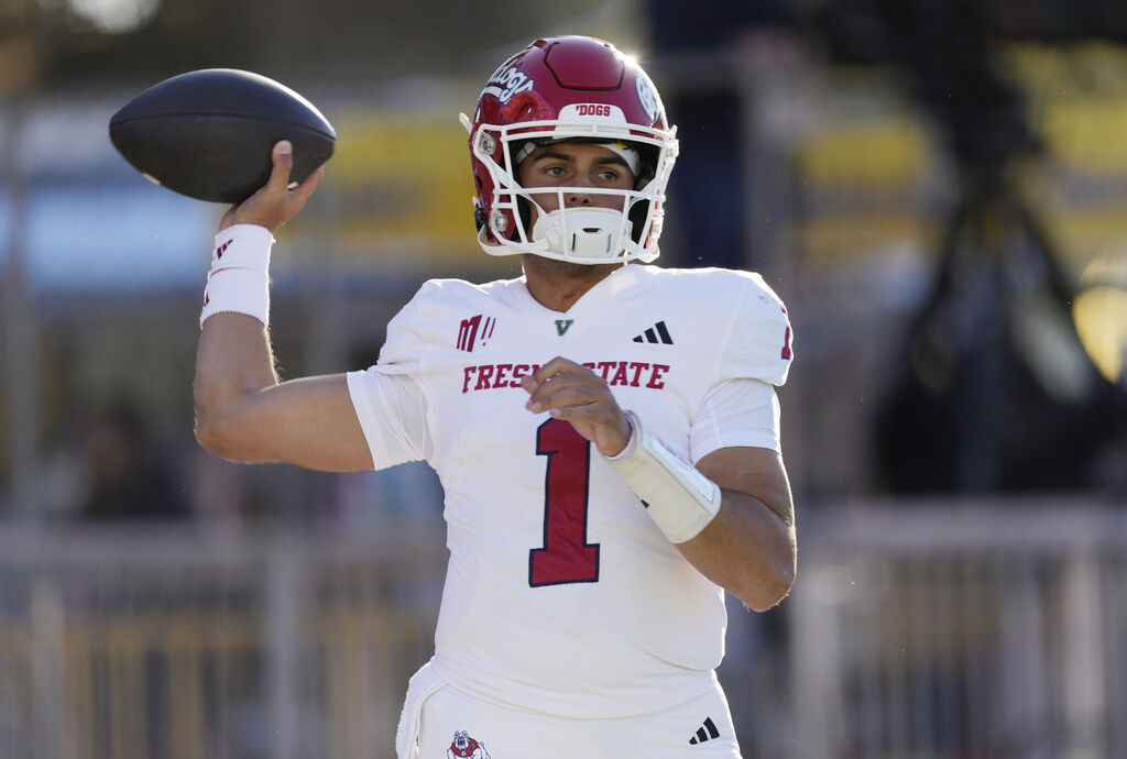 Fresno State quarterback Mikey Keene warms up for the team's NCAA college football game against Wyoming on Saturday, Oct. 7, 2023, in Laramie, Wyo. (AP Photo/David Zalubowski)