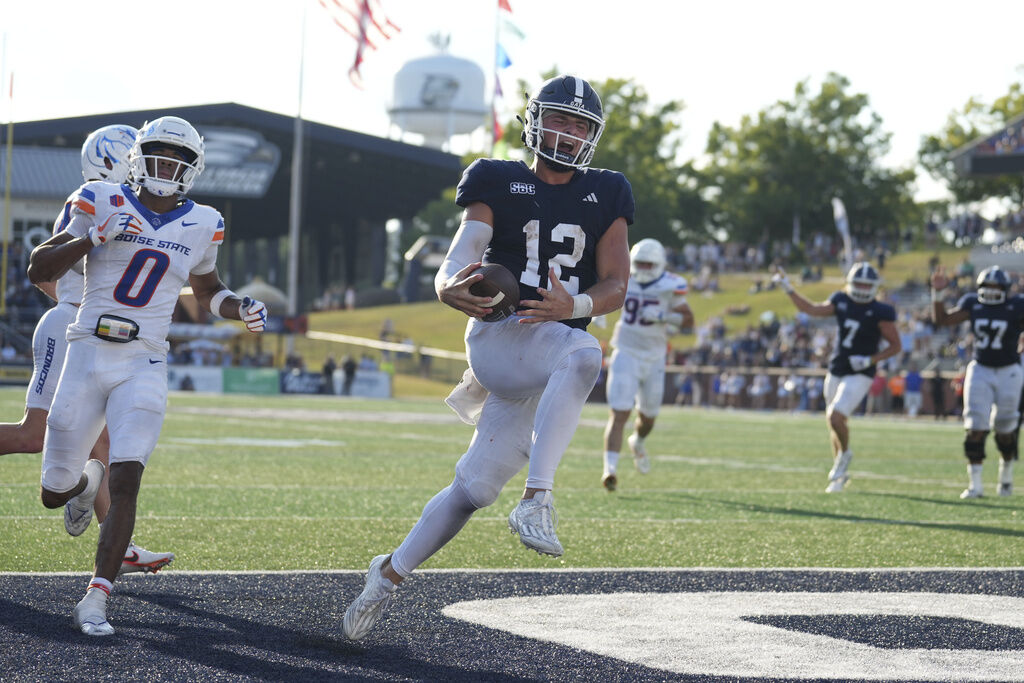 Georgia Southern Eagles quarterback JC French (12) rushed for a touchdown in the second half during an NCAA football game on Saturday, Aug. 31, 2024 in Statesboro, Ga. (AP Photo/Peter Joneleit)