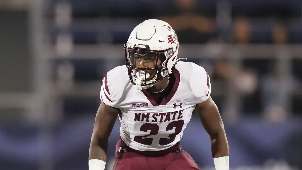 New Mexico State cornerback Naeten Mitchell (23) drops back in coverage in defense during an NCAA football game against Florida International University on Tuesday, Oct. 29, 2024 in Miami. (AP Photo/Peter Joneleit)