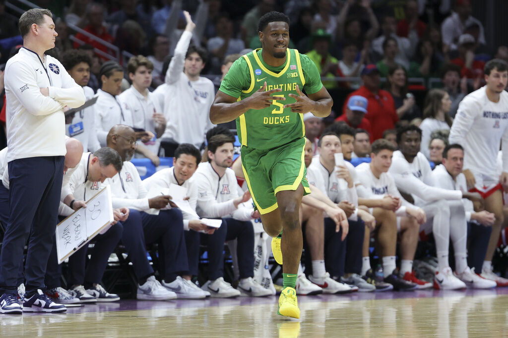 Oregon guard TJ Bamba celebrates a three-point basket against Arizona during the first half in the second round of the NCAA college basketball tournament, Sunday, March 23, 2025, in Seattle. (AP Photo/Ryan Sun)