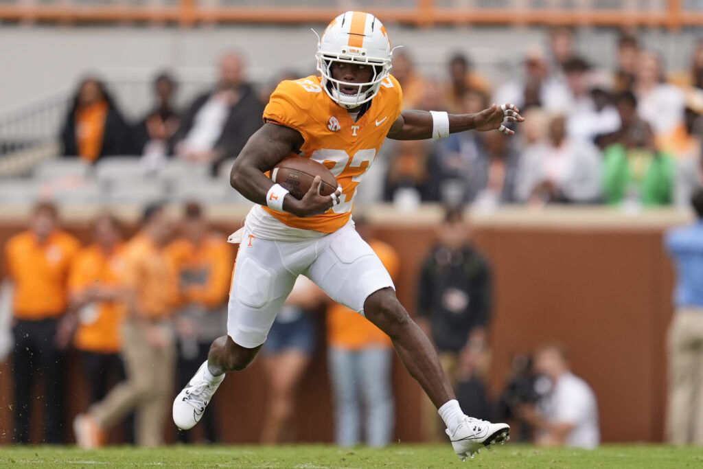 Tennessee punt returner Boo Carter (23) returns a punt during the first half of an NCAA college football game Saturday, Sept. 6, 2025, in Knoxville, Tenn. (AP Photo/George Walker IV)