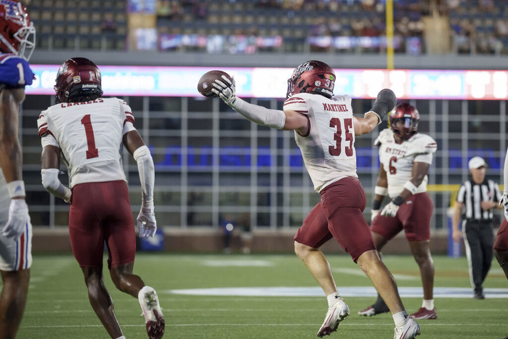 New Mexico State linebacker Tyler Martinez (35) celebrates an interception during the first half against Louisiana Tech of an NCAA football game on Saturday, Sept. 13, 2025, in Ruston, La. (AP Photo/Matthew Hinton)