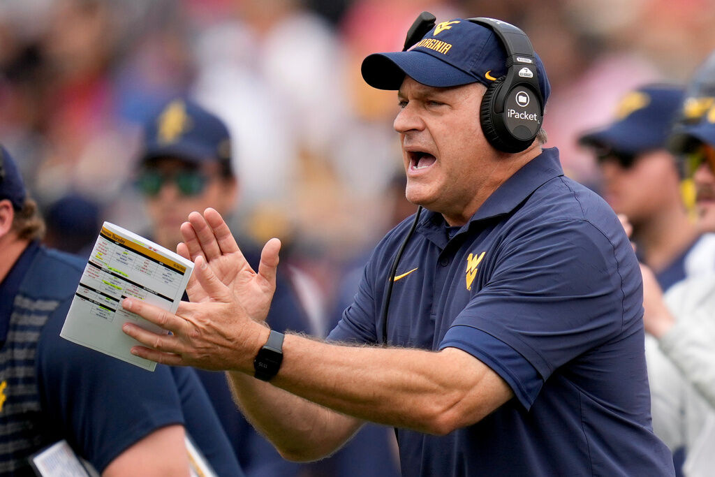 West Virginia head coach Rich Rodriguez yells from the sideline during the first half of an NCAA college football game against Houston, Saturday, Nov. 1, 2025, in Houston. (AP Photo/Eric Christian Smith)
