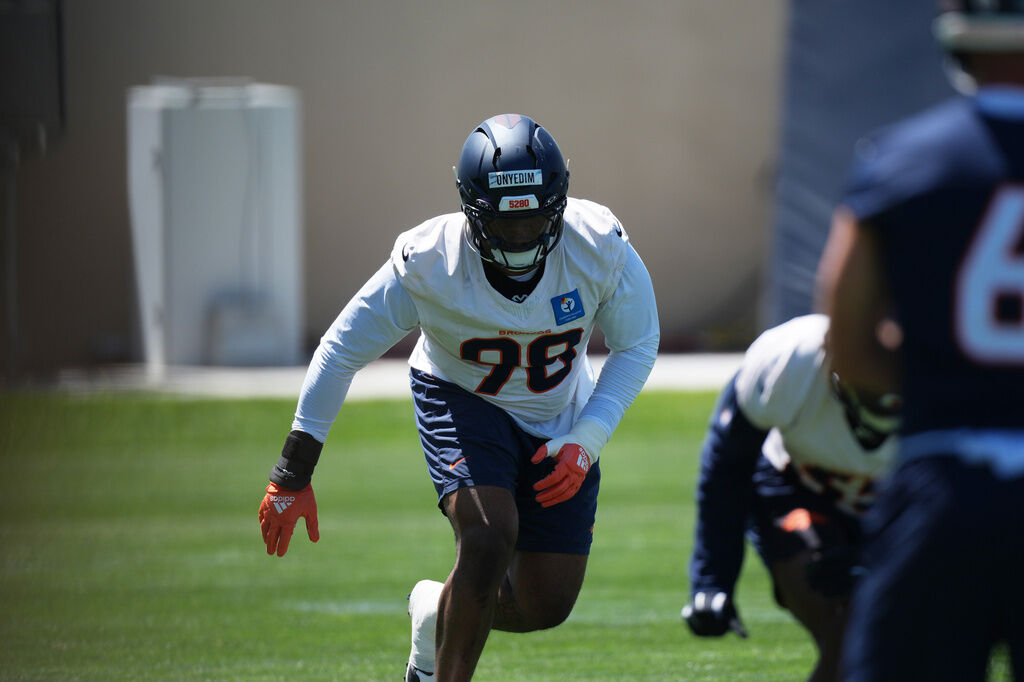 Denver Broncos defensive tackle Tyler Onyedim (98) stretches before drills at the NFL football team's rookie minicamp Saturday, May 9, 20-26, at the team's headquarters in Centennial, Colo. (AP Photo/David Zalubowski)