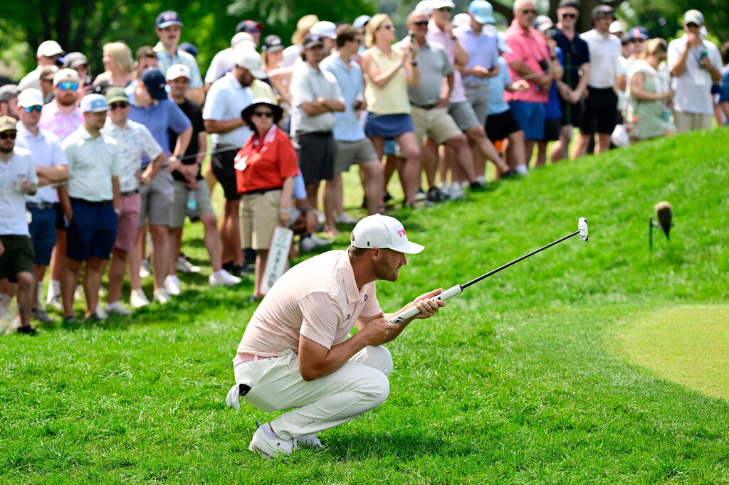 Wyndham Clark lines up his putt on the second hole during the final round of the Travelers Championship golf tournament at TPC River Highlands, Sunday, June 28, 2026, in Cromwell, Conn. (AP Photo/Jessica Hill)