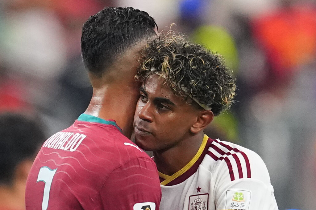 Spain's Lamine Yamal, right, hugs Portugal's Cristiano Ronaldo (7) after the World Cup round of 16 soccer match between Portugal and Spain in Arlington, Texas, near Dallas, Monday, July 6, 2026. (AP Photo/Julio Cortez)