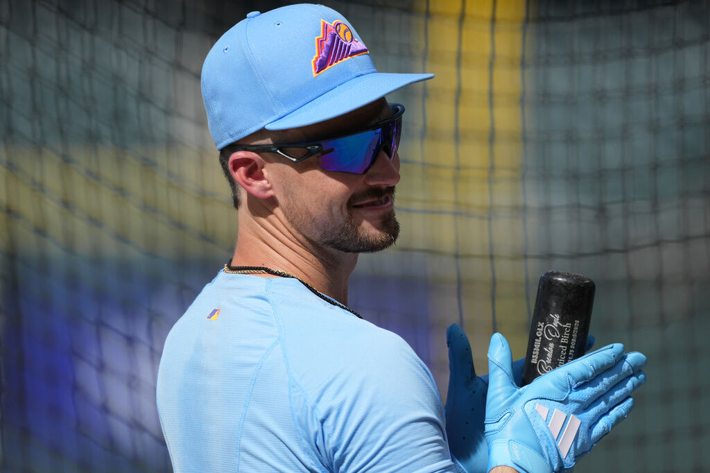 Colorado Rockies outfielder Brenton Doyle waits for his turn in the batting cage before a baseball game against the Cincinnati Reds, Friday, July 17, 2026, in Denver. (AP Photo/David Zalubowski)