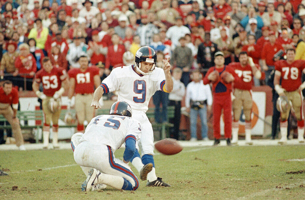 New York Giants quarterback Jeff Hostetler holds the ball as Matt Bahr kicks game-winning field goal in final seconds of NFC championship game with San Francisco 49ers at Candlestick Park in San Francisco, Sunday, Jan. 20, 1991. Giants go on to the Super Bowl with a 15-13 victory. (AP Photo/Paul Sakuma)