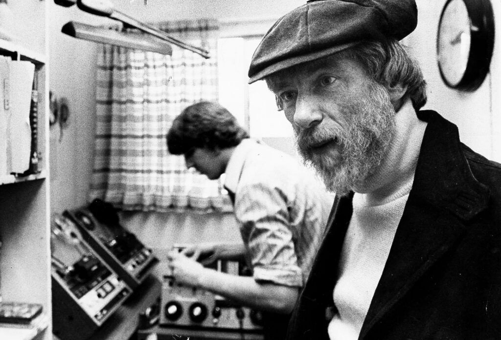 In this file photo, the late Denver radio host Alan Berg listens to a tape of a man who had threatened him on the air. A KOA producer later identified the caller as David Lane, a Denver-born member of the Aryan Nation who was later convicted as a co-conspirator in Berg’s assassination. (John Gordon, Rocky Mountain News via Denver Public Library)