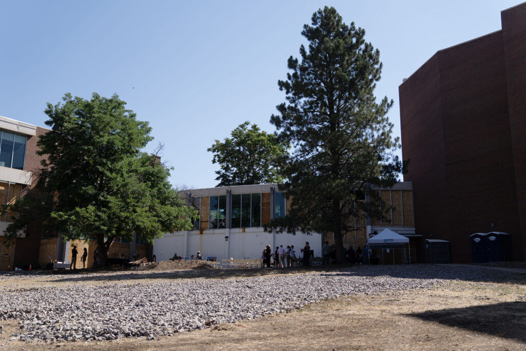 people with shovels can be seen at the groundbreaking of the Loretto Theatre rennovation project