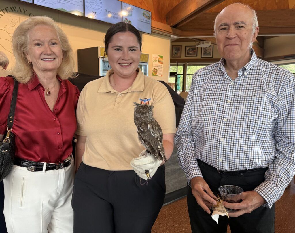 Garden of the Gods Foundation. Diane Wengler, left, and Steve Morrissett meet Thistle, an Eastern Screech Owl with Johni Poggemeyer of Nature's Educators. Linda Navarro, The Gazette