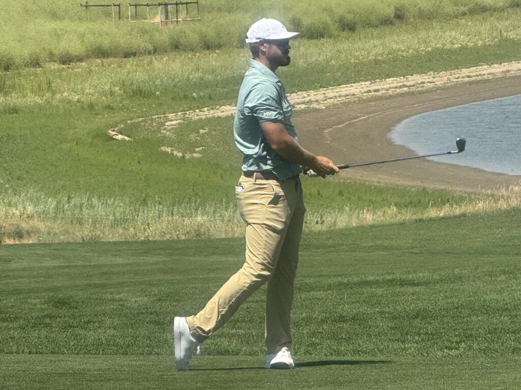 Air Force Academy graduate Kyle Westmoreland watches his second shot into the 18th green on Thursday, July 9, 2026, at The Blue Championship at TPC Colorado in Berthoud. (Chris Schmaedeke/The Denver Gazette)