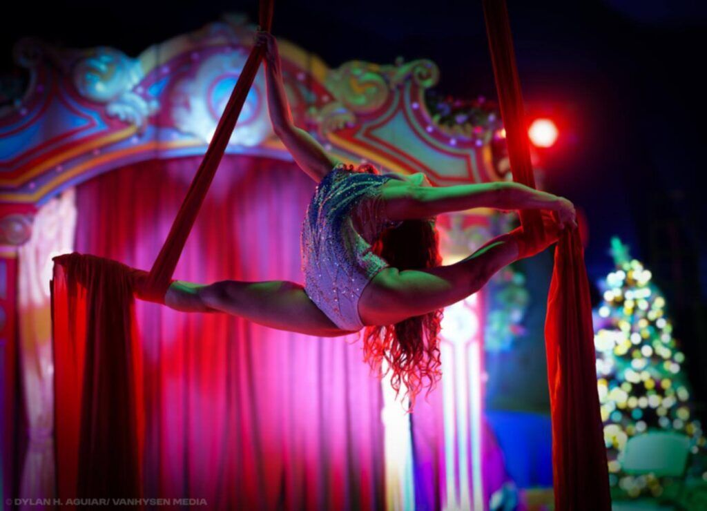 An acrobat performs aerial stunts using aerial silks at the Circus Golden Star. (Photo courtesy of Circus Golden Star)