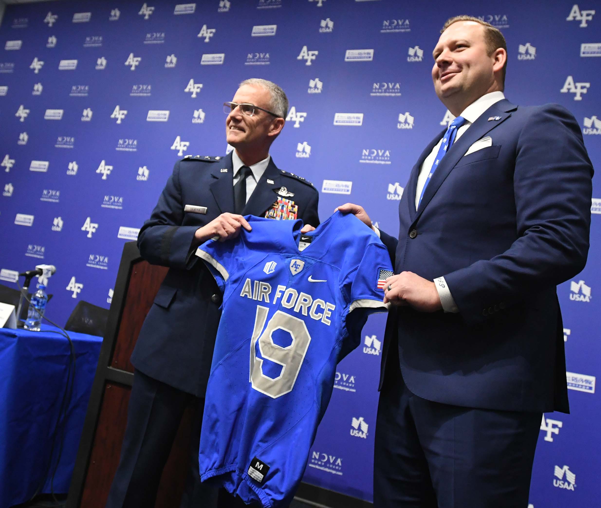 Air Force Academy athletic director Nathan Pine, right, holds a jersey with Superintendent Lt. Gen. Jay Silveria (The Gazette file)