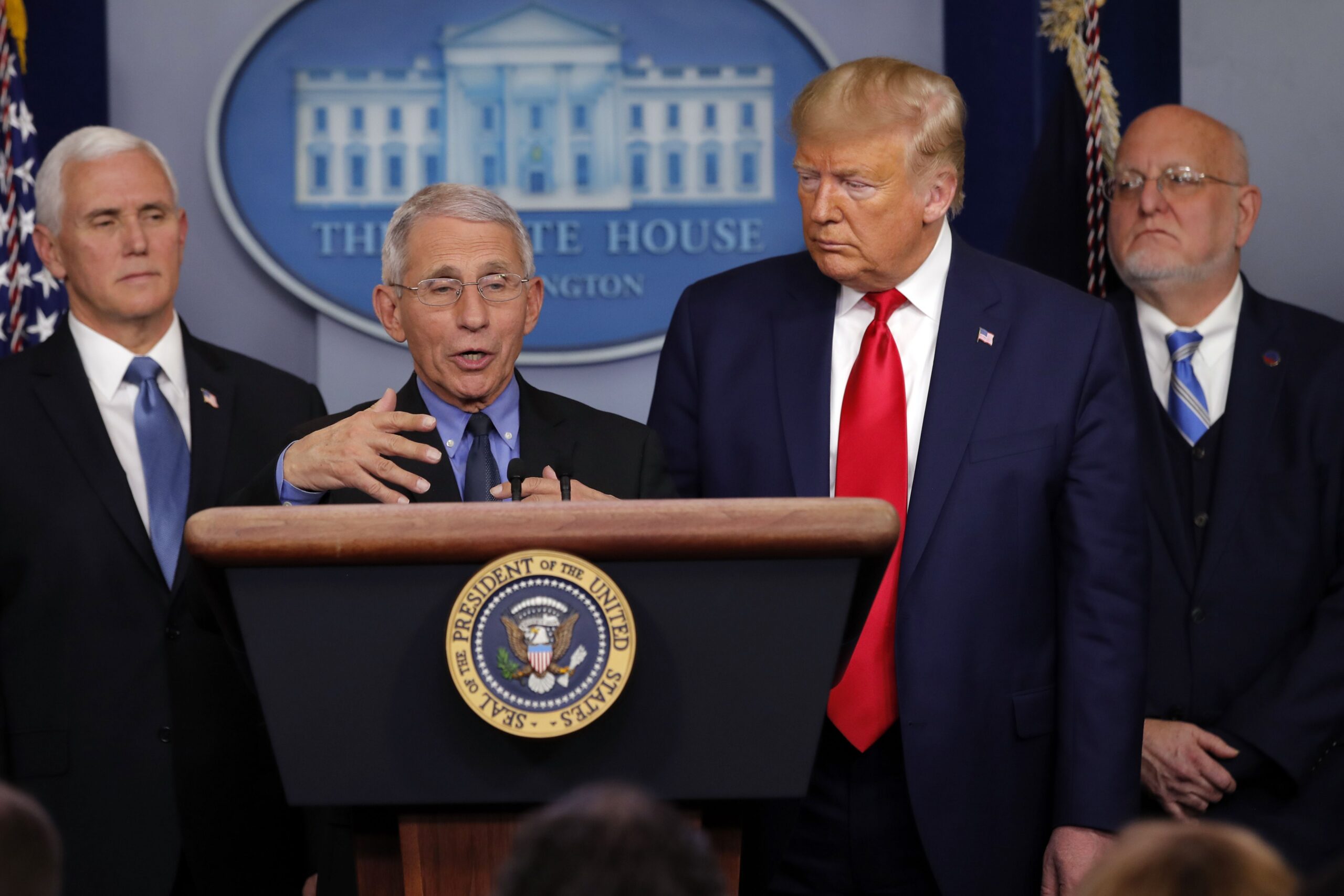 FILE - In this Saturday, Feb. 29, 2020 file photo, National Institute for Allergy and Infectious Diseases Director Dr. Anthony Fauci speaks as President Donald Trump and Vice President Mike Pence listen during a briefing about the coronavirus in the press briefing room at the White House in Washington. At right is Robert Redfield, director of the Centers for Disease Control and Prevention.  (Carolyn Kaster, The Associated Press)