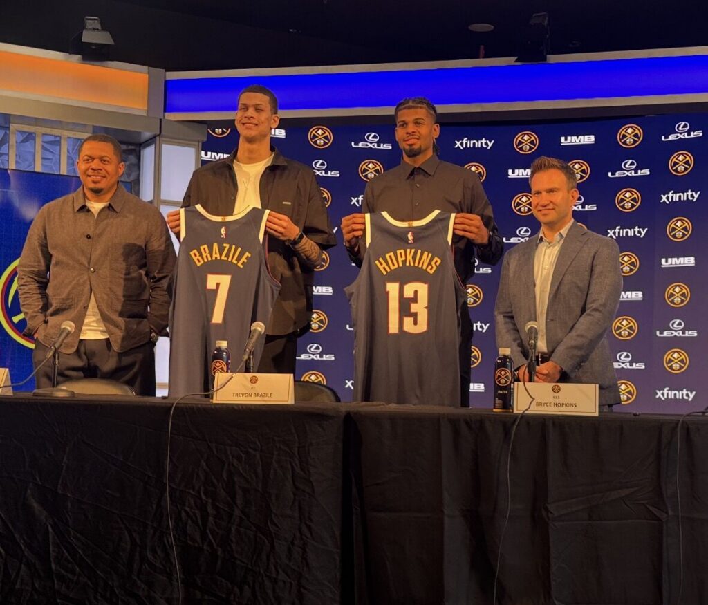 Denver Nuggets executives Jon Wallace (left) and Ben Tenzer (right) flank Trevon Brazile and Bryce Hopkins at the 2026 draft picks' introductory press conference Monday, June 29 at Ball Arena.