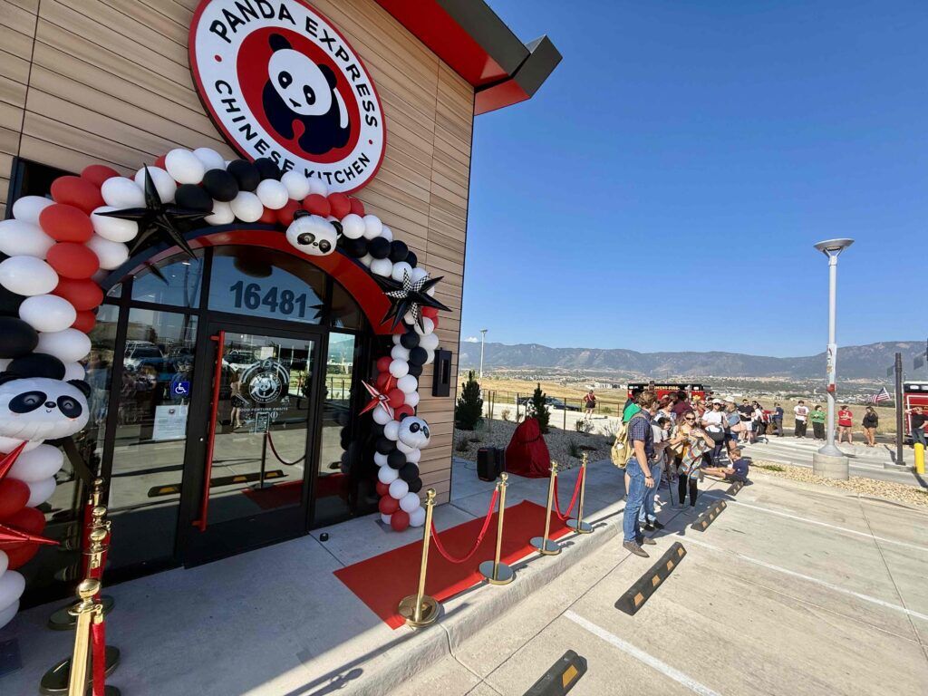 The first gathering of customers lined up outside Monument's first Panda Express July 21 at 16481 Cinematic View before its grand opening and ribbon-cutting ceremony. The first customer received a special commemorative gift, while the following 88 guests through the doors were presented with limited-edition Orange Chicken T-shirts, tote bags and panda keychains as the restaurant officially opened for business. (Benn Farrell, The Tribune)